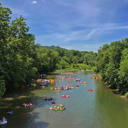 Colorful rafts and tubes floating down the Kentucky River