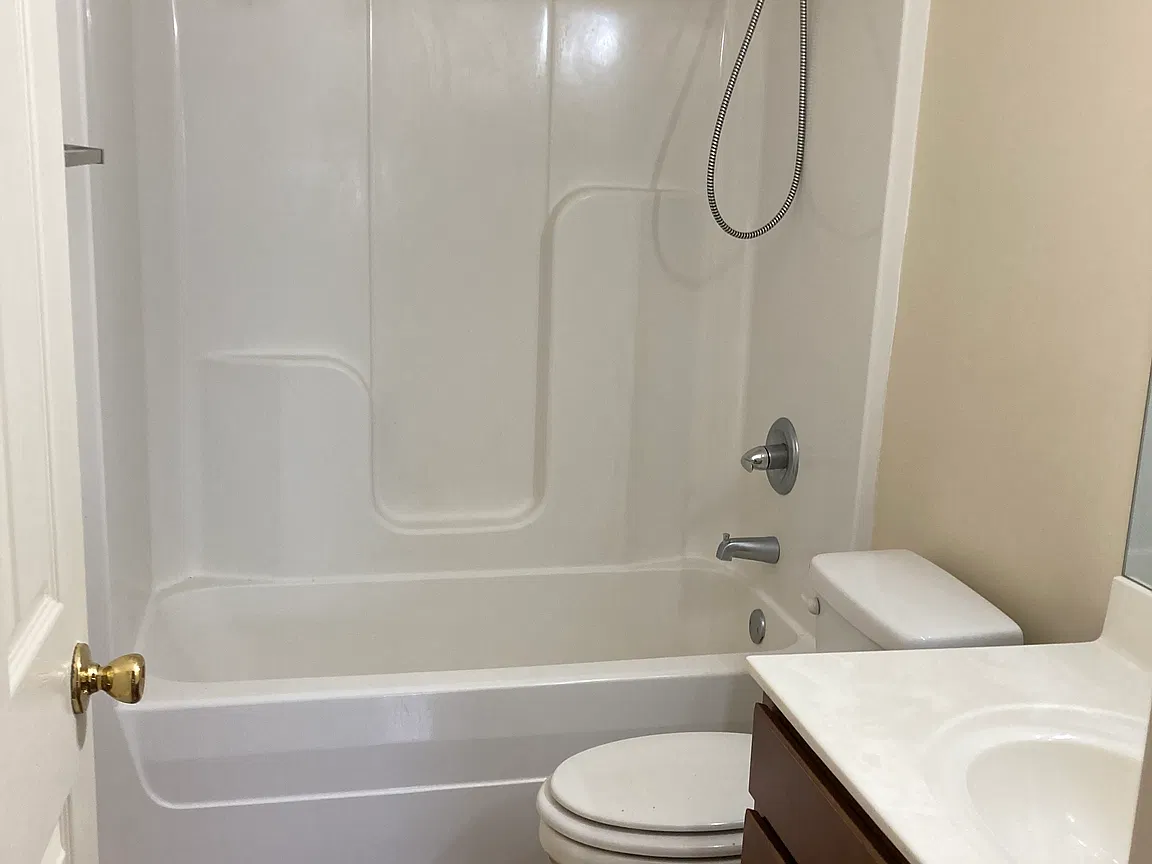 Full bathroom with tub and shower combination