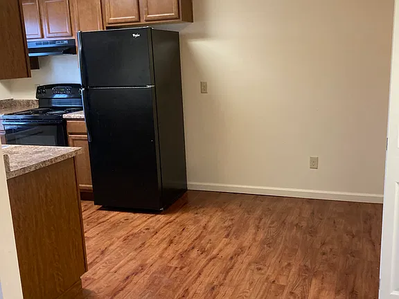 Kitchen with full-size refrigerator and dining nook